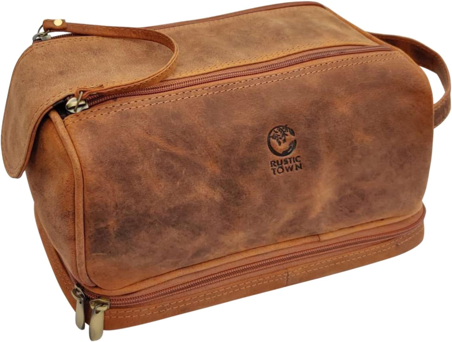 Trousse de toilette en cuir marron Rustic Town — vue de face

Trousse de toilette homme en cuir — compartiment inférieur zippé

Trousse de voyage en cuir — organisation intérieure

Trousse de toilette Rustic Town — poignée et fermetures YKK

Trousse de toilette — format compact pour valise